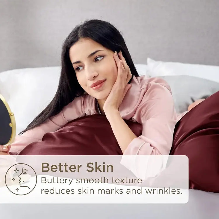 Woman lying on a bed with a satin pillowcase, promoting better skin care.