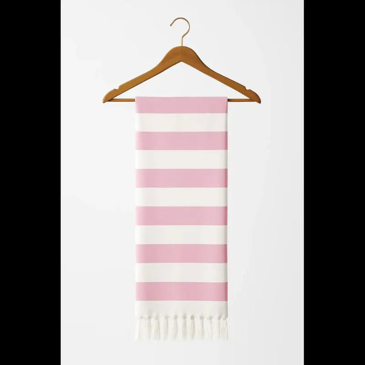 Pink and white striped scarf with fringes on a wooden hanger against a white background