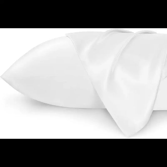 Close-up of white fabric with a subtle pattern on a white background
