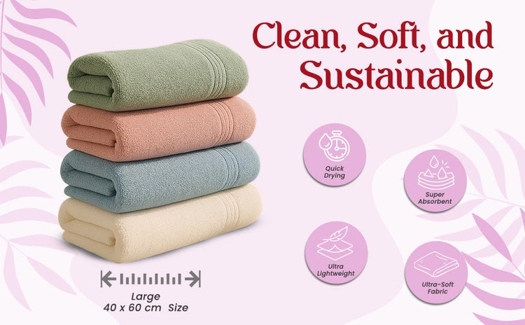 Stack of folded towels with sustainability features on a pink background